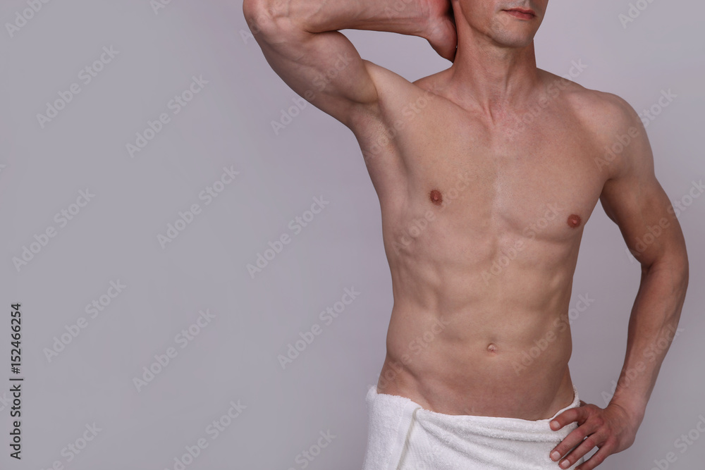 Male laser epilation. Attractive man torso hair removal. Close up on perfect male body, muscles