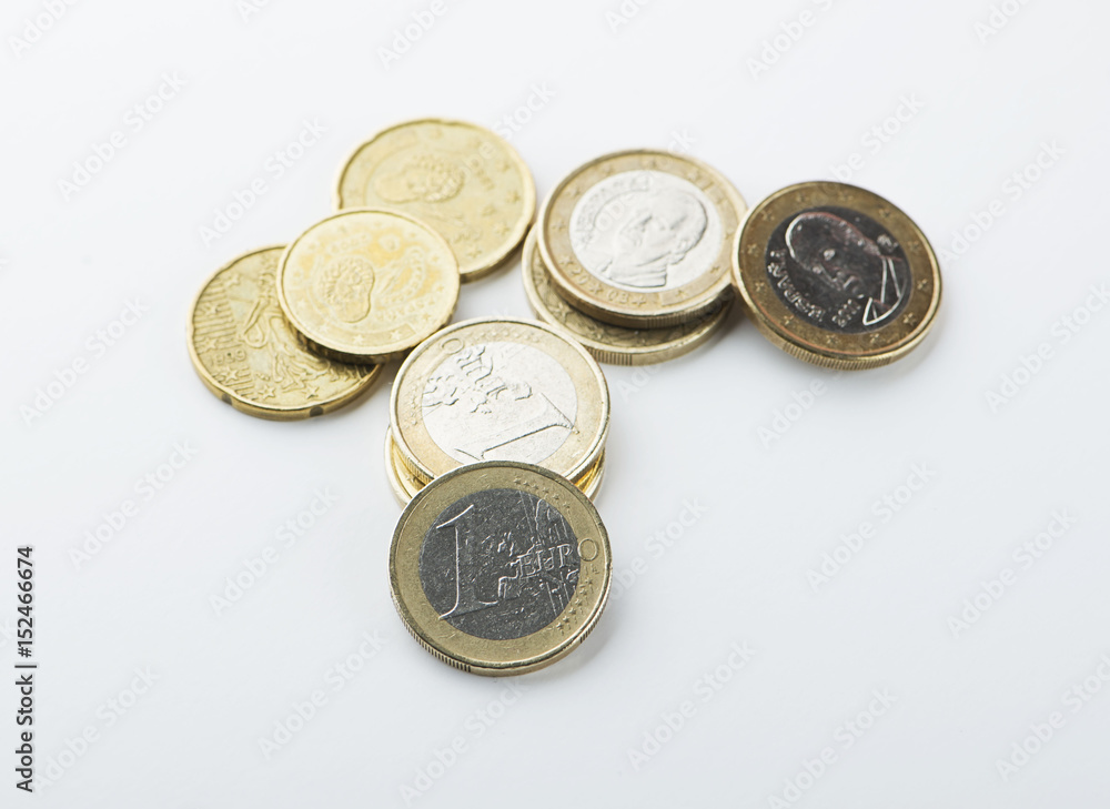 Various euro coins on white background. Isolated. Various euro coins on white background. Isolated.