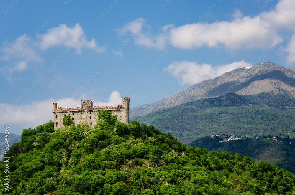 Castle of Montaldo Dora, in Canavese (Piedmont, Italy) with Alps on the background