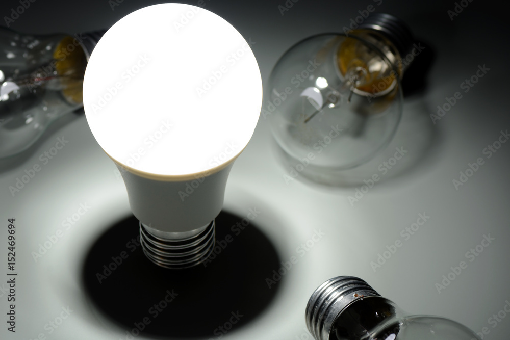 Glowing led lamp and incandescent bulbs in the dark Glowing led lamp and incandescent bulbs in the dark