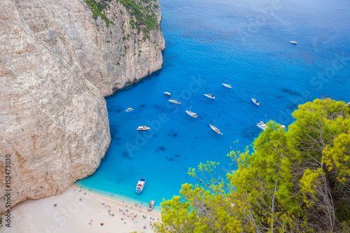 Navagio beach with yachts on Zakynthos island in Greece