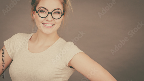 Happy teenage woman wearing eyeglasses