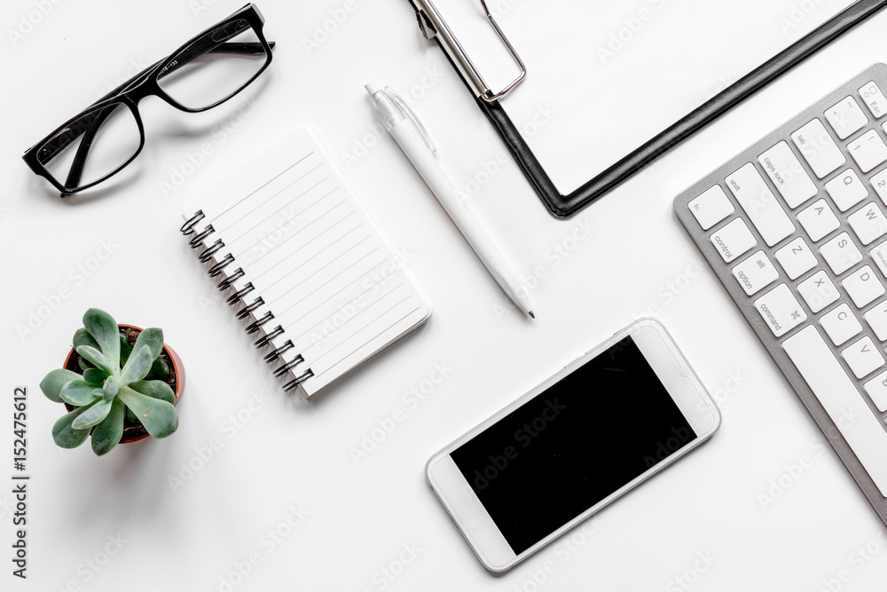 Workspace with keyboard and mobile office desk white background top view mock up Workspace with keyboard and mobile office desk white background top view mock up