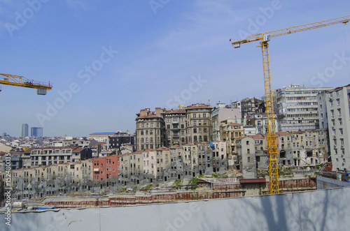 Construction of a new house on the background of old houses in Istanbul