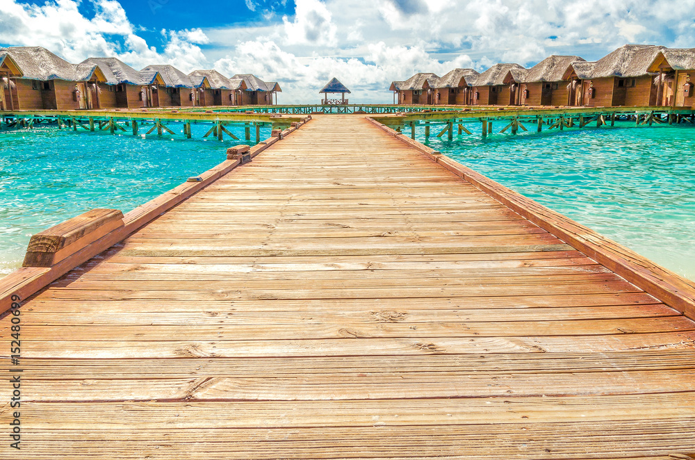 Fototapeta premium Wooden houses, bungalows in the Maldive Islands