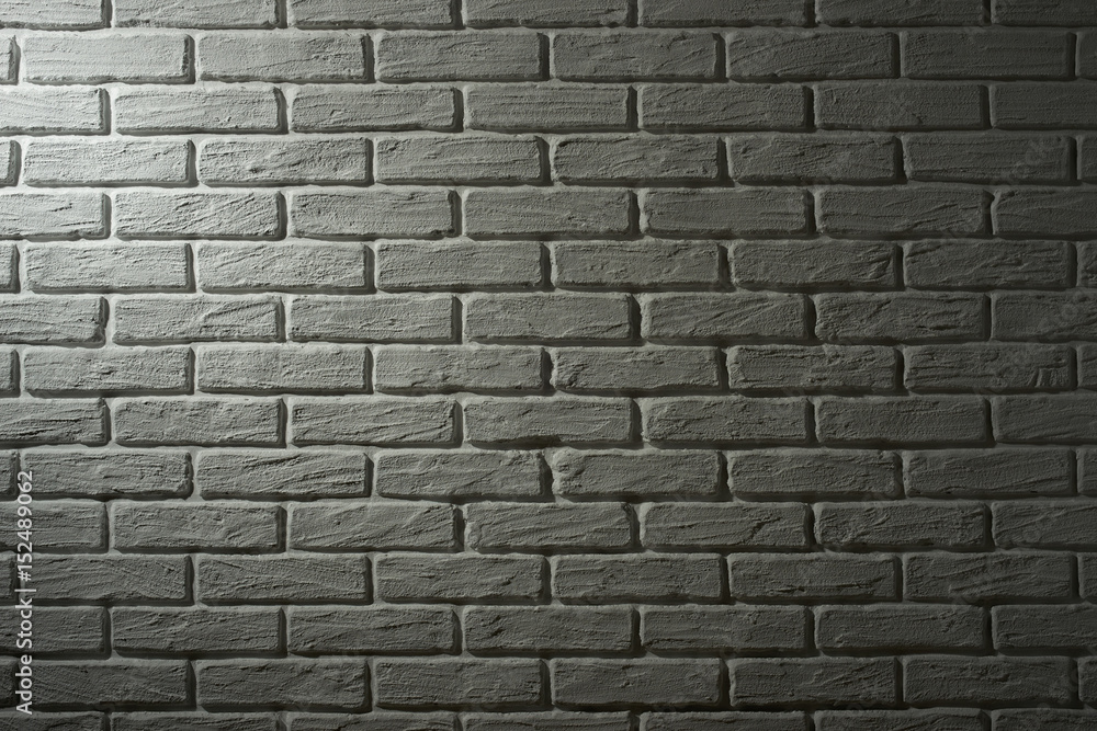 Fototapeta premium white brick wall with light effect and shadow, abstract background photo