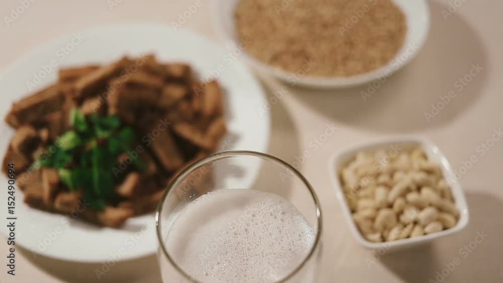 Closeup panoramic refocusing shot of glass of beer. Shot of top of glass with foam. Still life shot Closeup panoramic refocusing shot of glass of beer. Shot of top of glass with foam. Still life shot