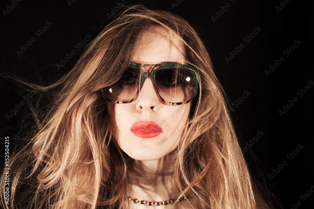 Face of young woman dressed in sunglasses Face of young woman dressed in sunglasses