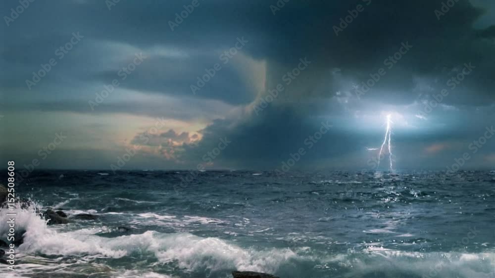 Cinematic storm clouds with lightning strikes reflecting in ocean.