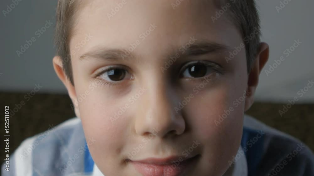 close up portrait of little boy looking at camera close up portrait of little boy looking at camera