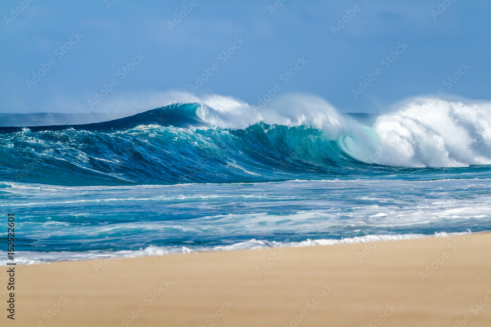 Breaking Ocean waves on the Beach on the north shore of Oahu Hawaii