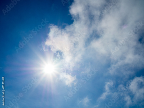 Sun light with blue sky and clouds