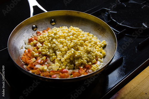 Sweet corn red peppers and onions