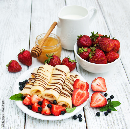 crepes with strawberries and chocolate sauce