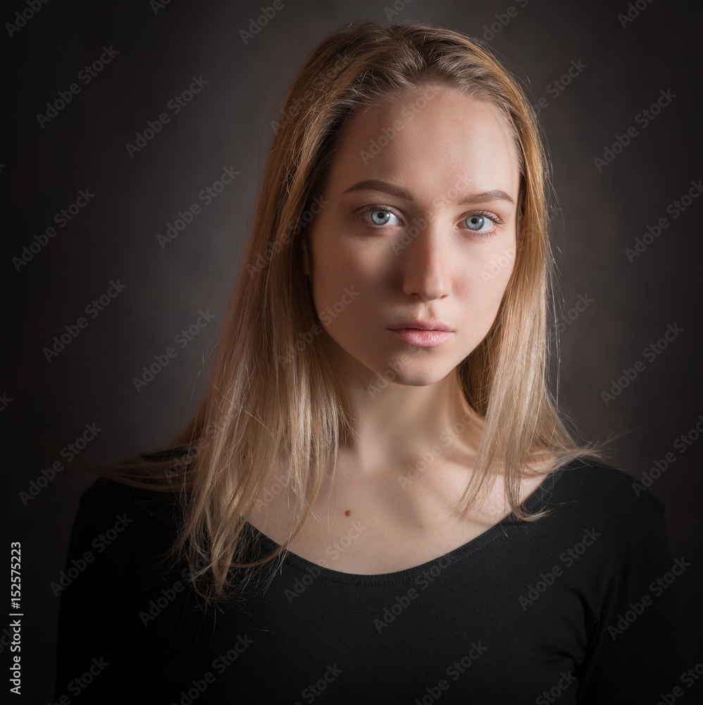 Portrait of a beautiful young woman with blue eyes. Portrait of a beautiful young woman with blue eyes.