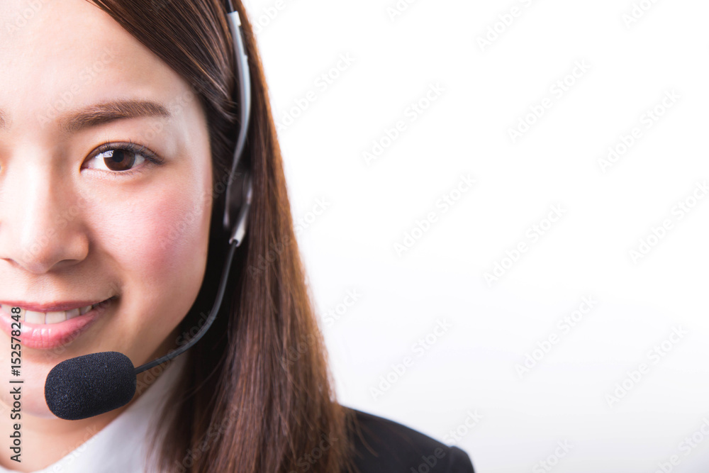 Happy smiling female customer support phone operator in headset Happy smiling female customer support phone operator in headset