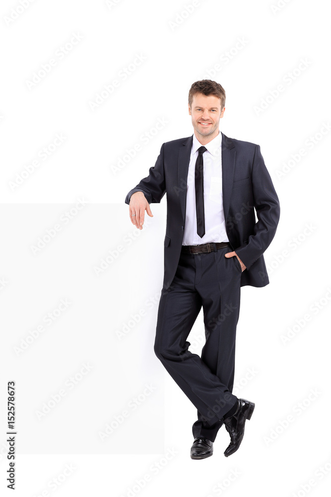 Handsome business man stands next to the banner Handsome business man stands next to the banner