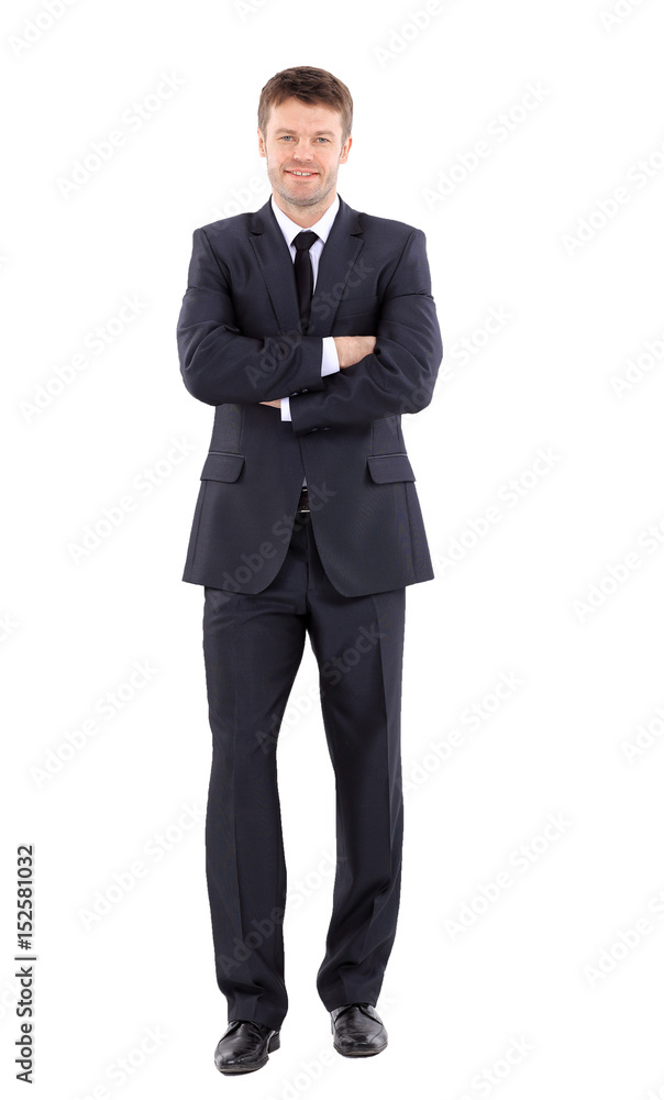 Portrait of a handsome business man  in suit smiling with arms  