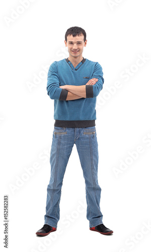 Portrait of a handsome casual man smiling with arms  folded