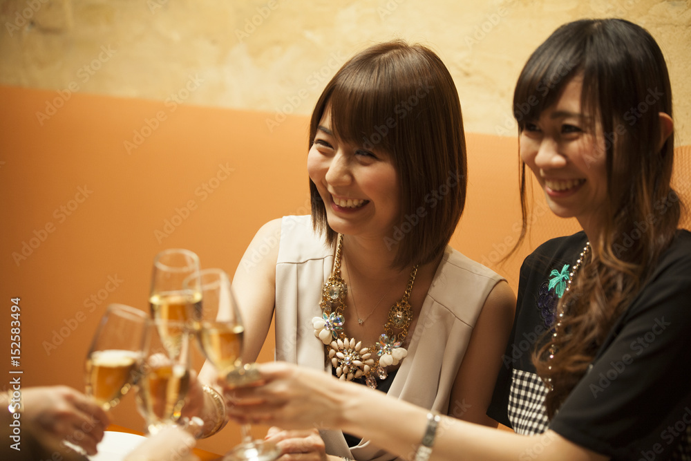 Four people are drinking with champagne Four people are drinking with champagne