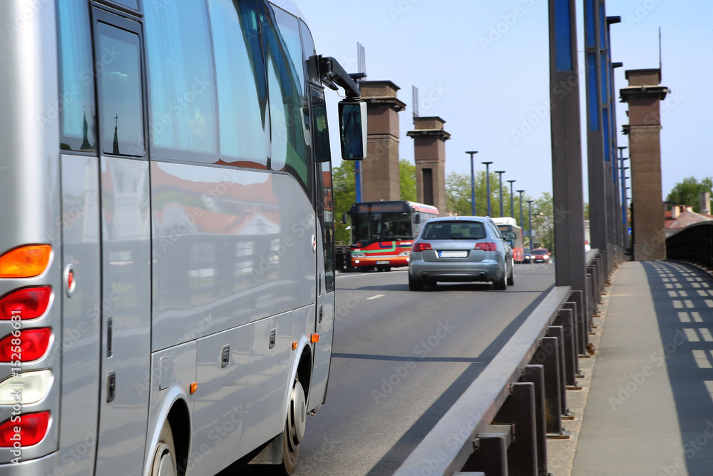 City cars on bridge. Street traffic with bus. Public transport.