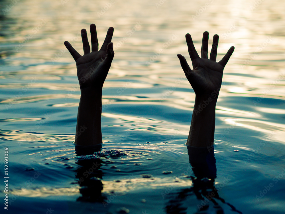 Drowning victims, Hand of drowning man needing help. Failure and rescue concept.