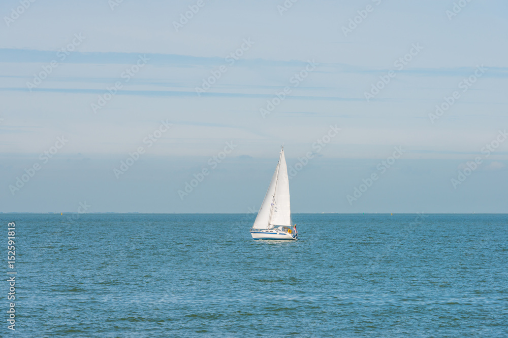 Sailboat sailing in a lake in spring