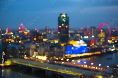Night city of London view in blur. City street blurry photo, bokeh image. UK