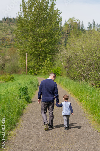 Father and Son Walking Holding Hands