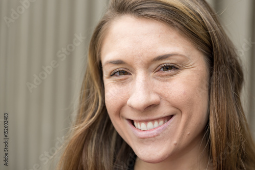 Smiling Millennial Women With Brown Hair