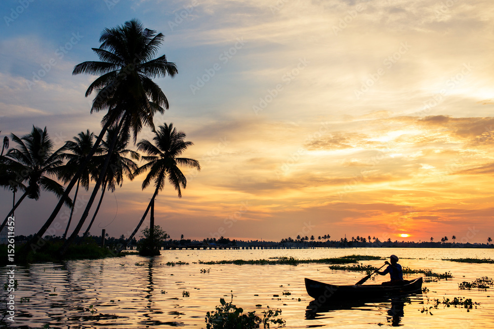 a beautiful Sunset at kerala allapey beach with blueish red sky boat a beautiful Sunset at kerala allapey beach with blueish red sky boat