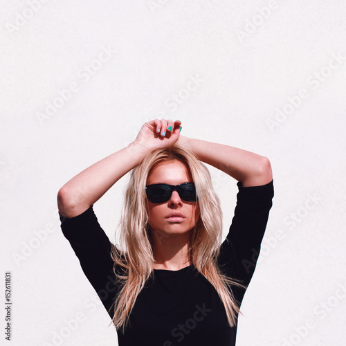Fashion hipster girl in cool sunglasses
