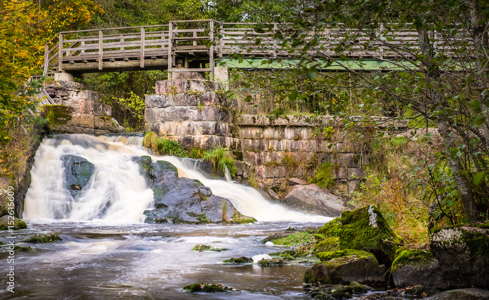 Fototapeta premium Landscape with flowing river at autumn day in national park Finland