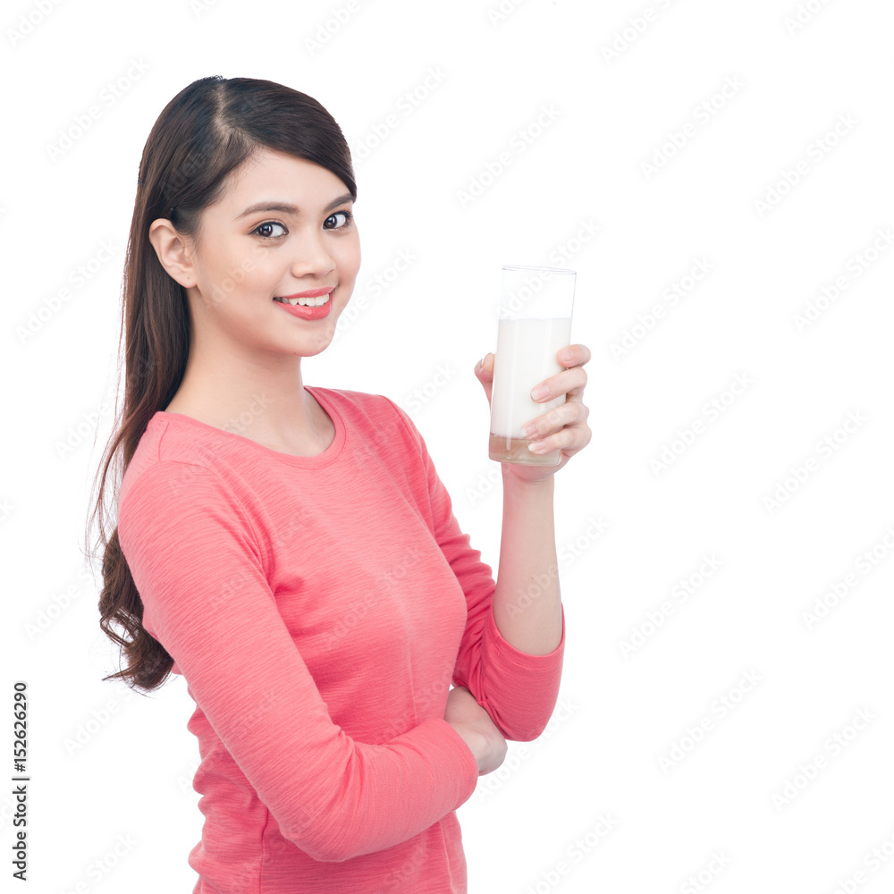 Portrait of pretty smiley asian young woman with glass of milk Portrait of pretty smiley asian young woman with glass of milk
