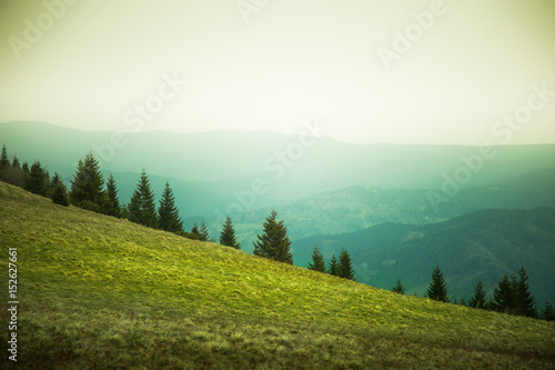 A beautiful mountain pass landscape of Tatra mountains in Slovakia. Colorful warm spring haze look.