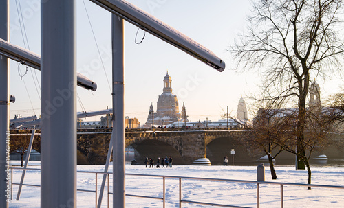 Elbufer und Augustusbruecke mit Frauenkirche und Rathausturm in Dresden photo