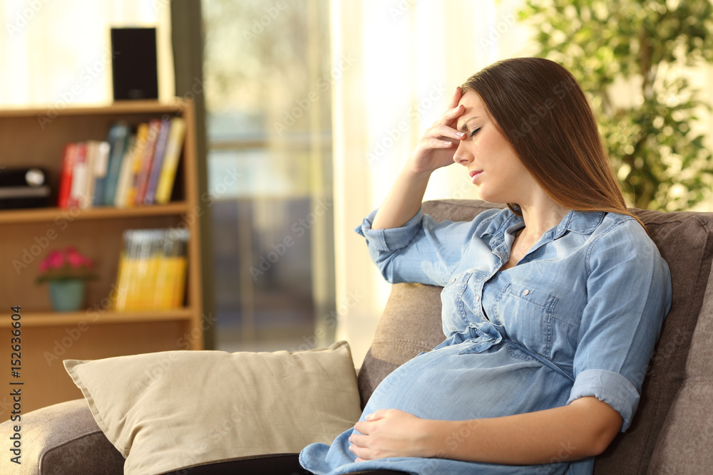 Pregnant woman suffering headache Pregnant woman suffering headache