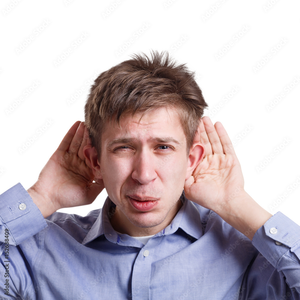 Man holding hands near ears, grimacing, gossip Man holding hands near ears, grimacing, gossip