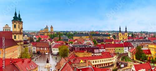 Panoramic view of Eger city, Hungary with red roofs and blue sky. Travel european town background