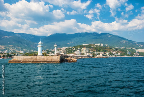 View of the coast of Yalta and a lighthouse from the Black Sea