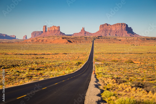 Monument Valley with U.S. Highway 163 at sunset, Utah, USA