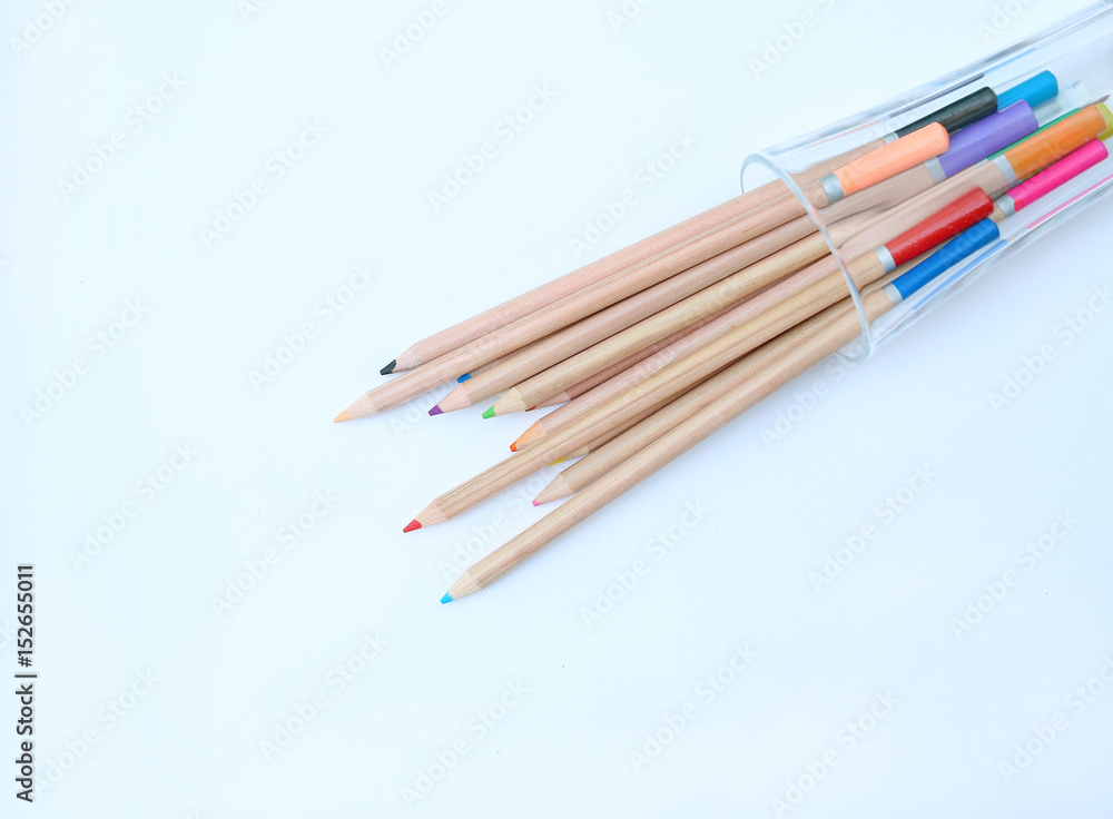 A stack of colored pencils on white background. A stack of colored pencils on white background.