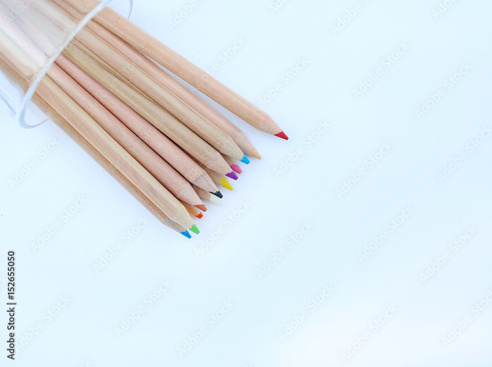 A stack of colored pencils on white background. A stack of colored pencils on white background.