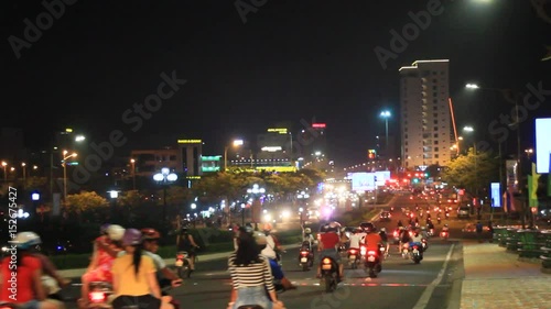 Traffic with motorcycles in Asian cities at night
