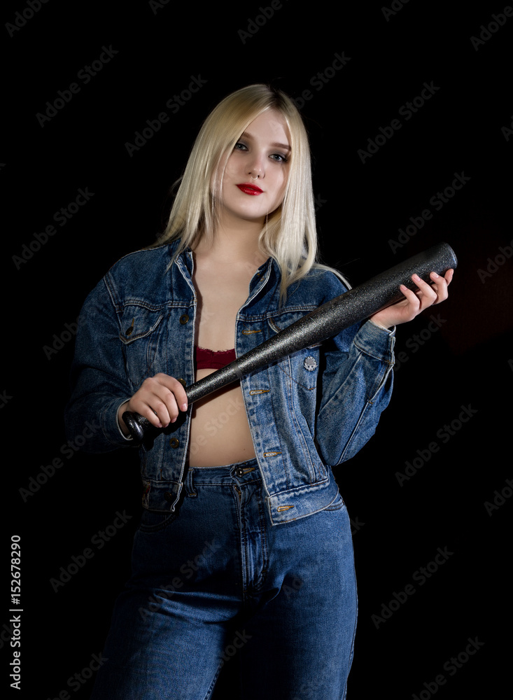 Criminal young woman with baseball bat, young hooligan in jeans and a denim  jacket Stock Photo | Adobe Stock
