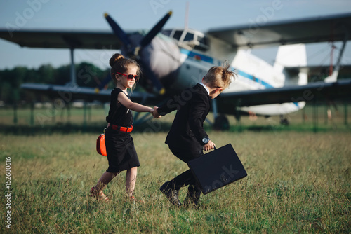 young boy and girl playing spy photo