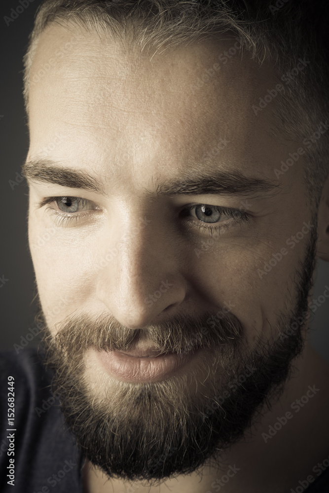 Portrait of a young man with a beard. Toned Portrait of a young man with a beard. Toned
