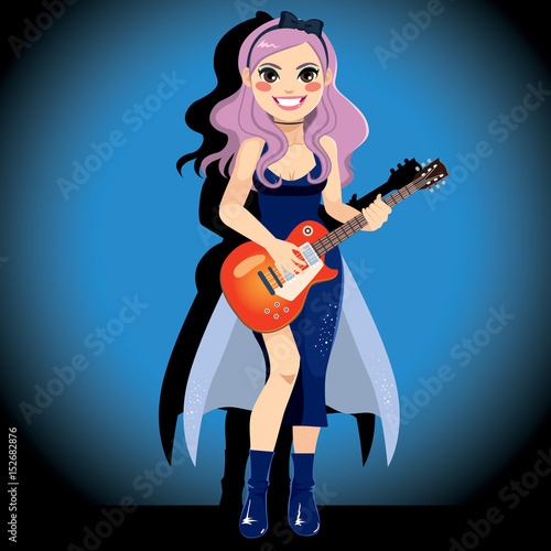 Beautiful female pop star artist with guitar on stage