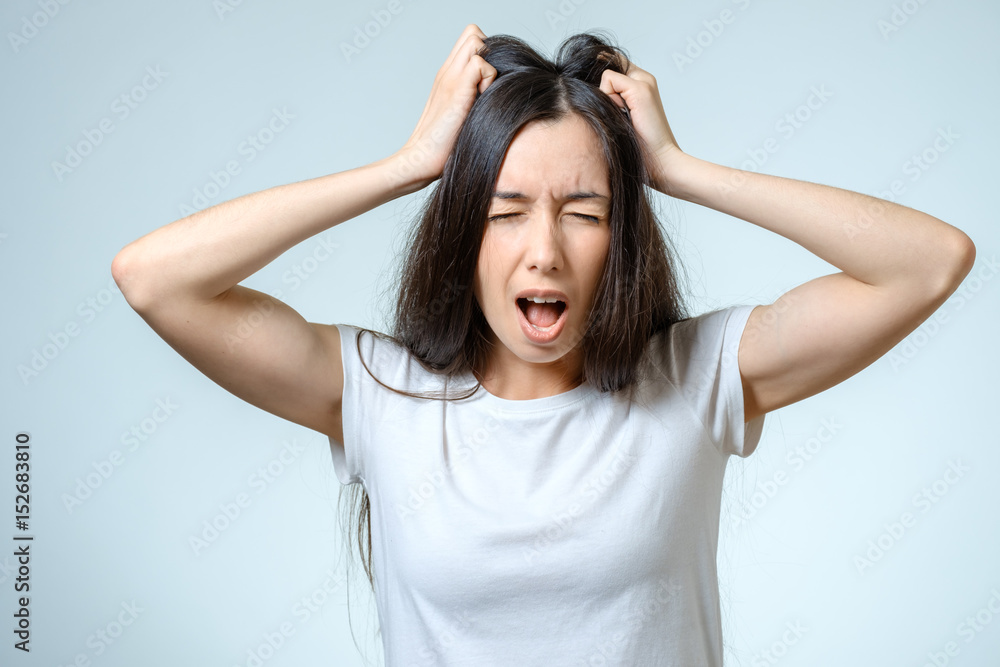 Fototapeta premium Young serious angry woman portrait