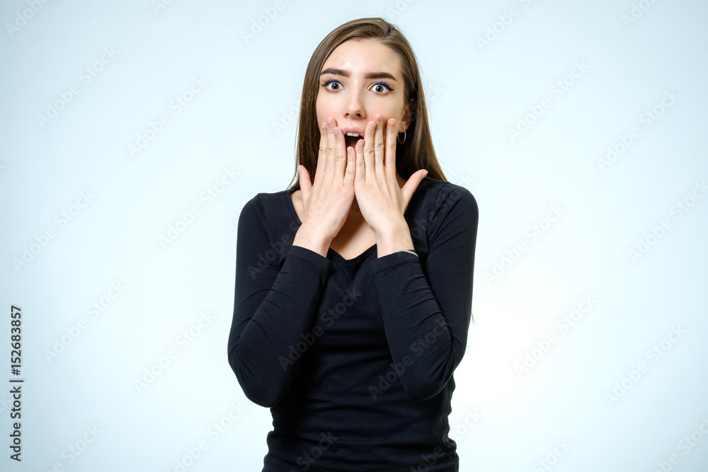 Portrait of a beautiful brunette girl with a surprised look Portrait of a beautiful brunette girl with a surprised look